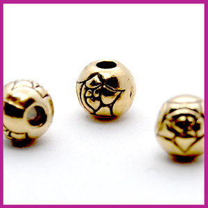 Metaal kraaltje rond bewerkt roos Ø6mm Goud